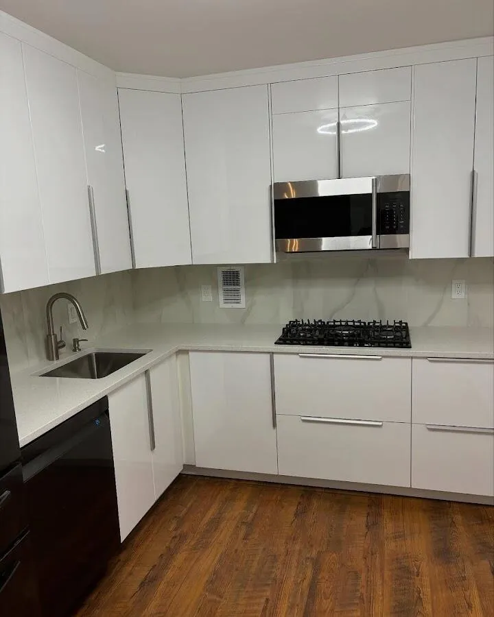 Restored kitchen with white cabinets after water damage in Capitol View